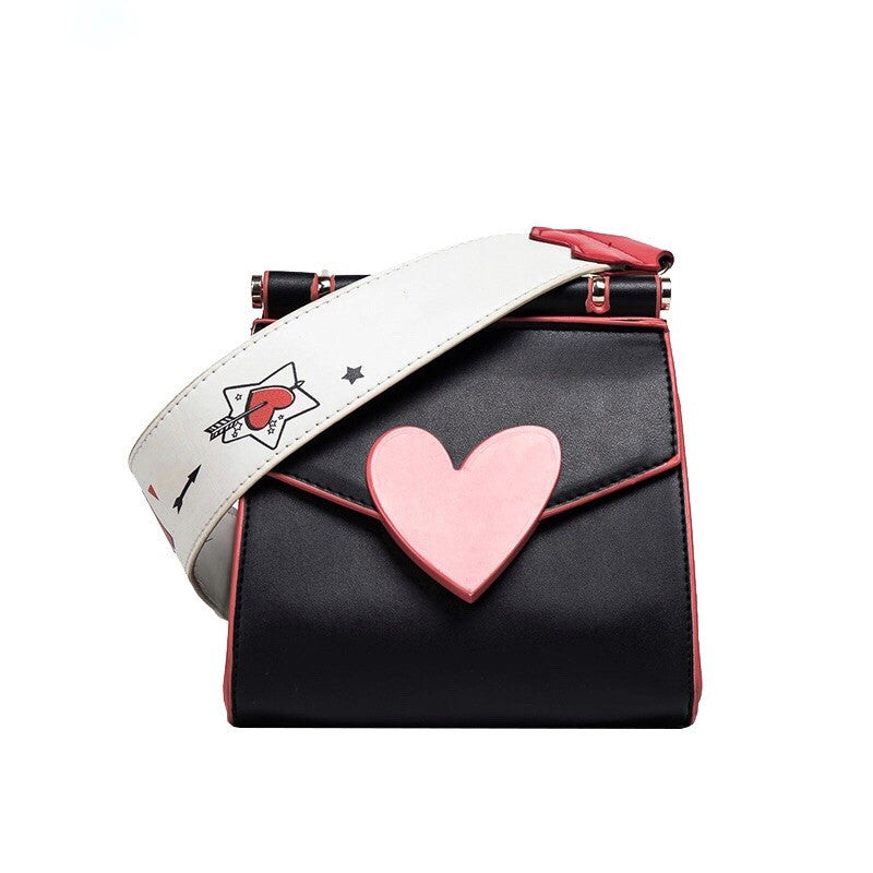 front view of red heart on black shoulder bag edgability