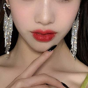 crystal studded heart shaped earrings with rhinestone tassels model view