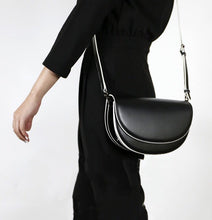 semi circle black and white sling bag edgability model view