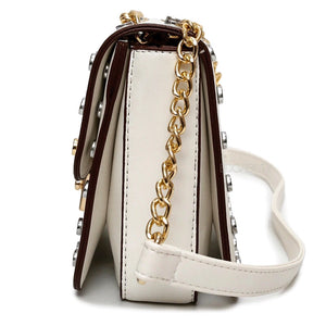 gold silver studded bag white bag edgability side view
