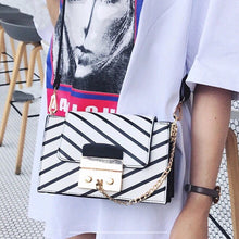 black stripes on white handbag model view edgability