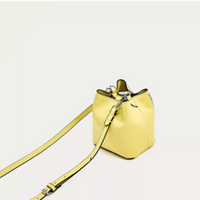 graphic studded yellow bucket bag back view edgability