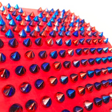 detail view of multicoloured studded iphone cover in red edgability