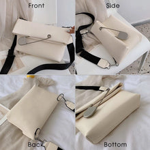 white clutch bag with safety pin edgability top view