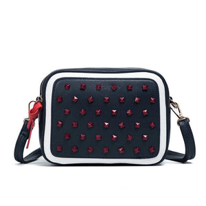 red studded navy blue sling bag edgability