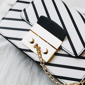 black stripes on white handbag detail view edgability