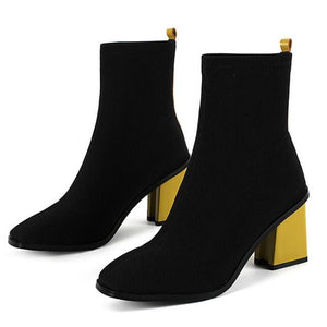 black boots ankle boots yellow heels edgability front view