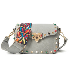 multi coloured studded sling bag front view edgability
