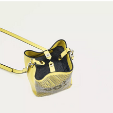 graphic studded yellow bucket bag top view edgability