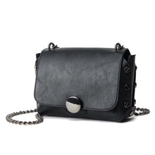 black handbag with screw studs edgability