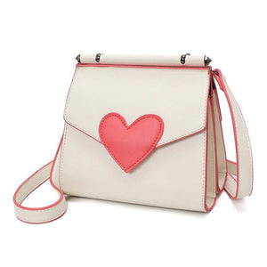 side view of red heart on white shoulder bag edgability