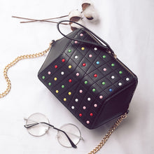 hexagonal studded black bag edgability top view