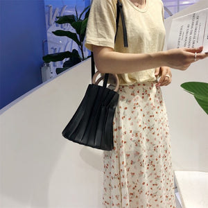 pleated bucket bag black bag edgability front view