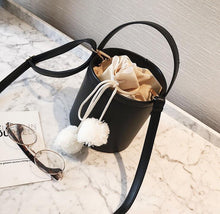 pom pom black bucket bag edgability top view