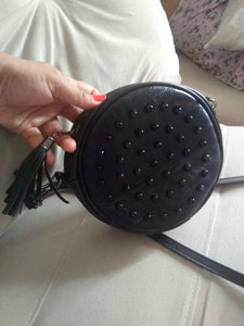 studded black round bag with tassels edgability model view