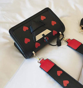 black bag hearts sling bag edgability top view