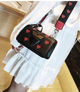 black bag hearts sling bag edgability model view