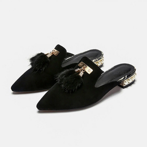 fur tassles on black flats angle view edgability