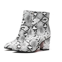 snakeskin boots ankle boots heeled boots edgability front view