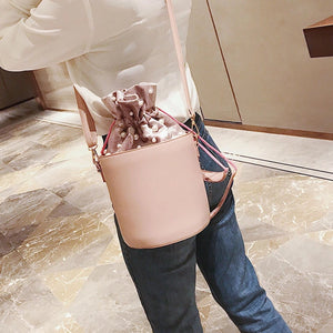pink studded bag bucket bag drawstring bag edgability model view