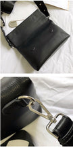 black clutch bag with safety pin edgability detail view