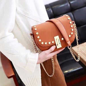 golden studded mini brown handbag model view edgability