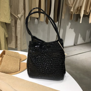 croc skin black bucket bag edgy fashion edgability front view