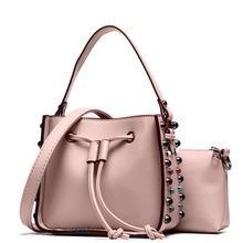 pink studded bucket bag edgability angle view