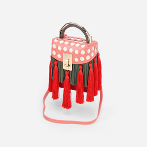 quirky box bag with red tassels edgability angle view