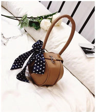 brown bag round bag mini bag clutch bag edgability angle view