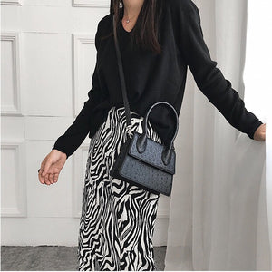 black bag ostrich leather classy bag edgability model view