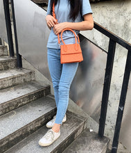 ostrich leather orange bag edgy fashion edgability model view