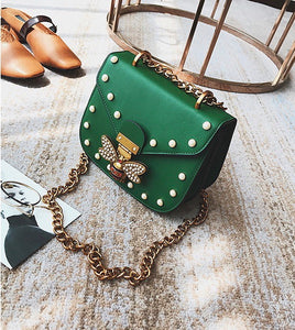 pearl studded butterfly green bag edgability top view