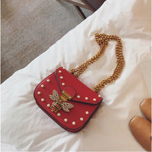 pearl studded butterfly red bag edgability top view