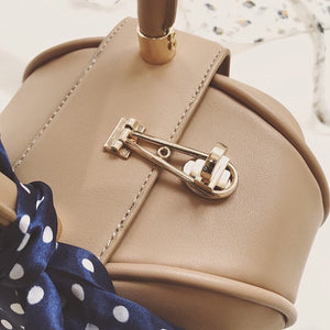 brown bag round bag mini bag clutch bag edgability detail view
