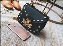 pearl studded butterfly black bag edgability top view