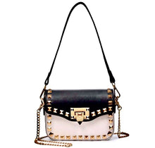 black and beige handbag with gold studs edgability