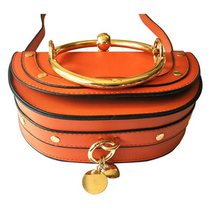 orange wristlet studded bag sling bag edgability bottom view