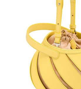 yellow bucket bag sling bag with cut outs edgability detail view