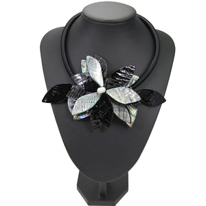 black gray statement necklace with exotic floral design edgability model view